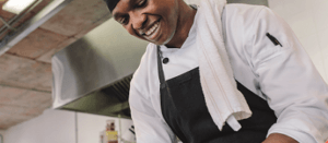 Production chef in work flow in a professional kitchen